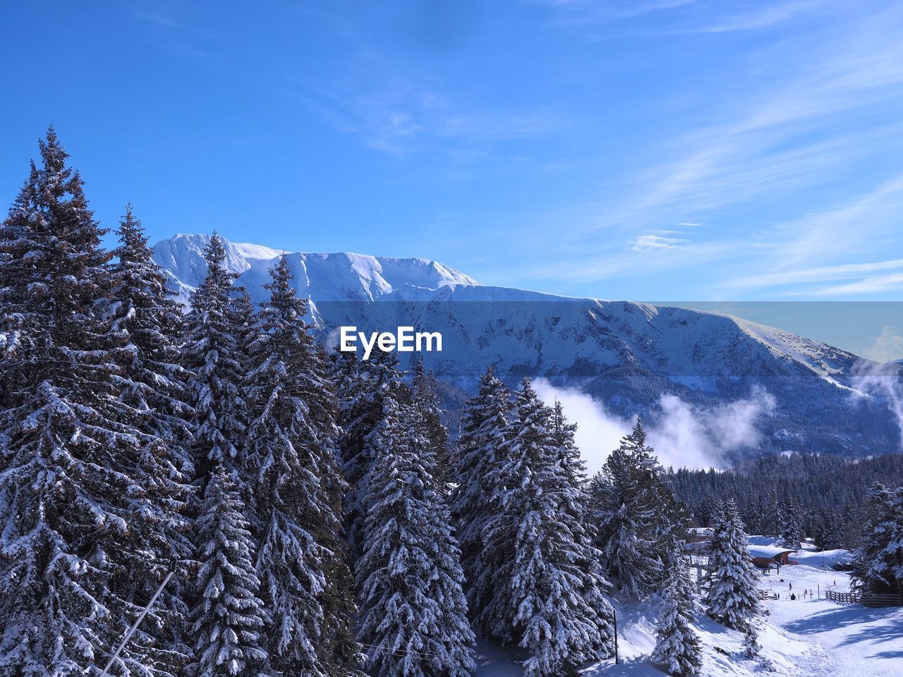 SNOWCAPPED MOUNTAINS AGAINST BLUE SKY