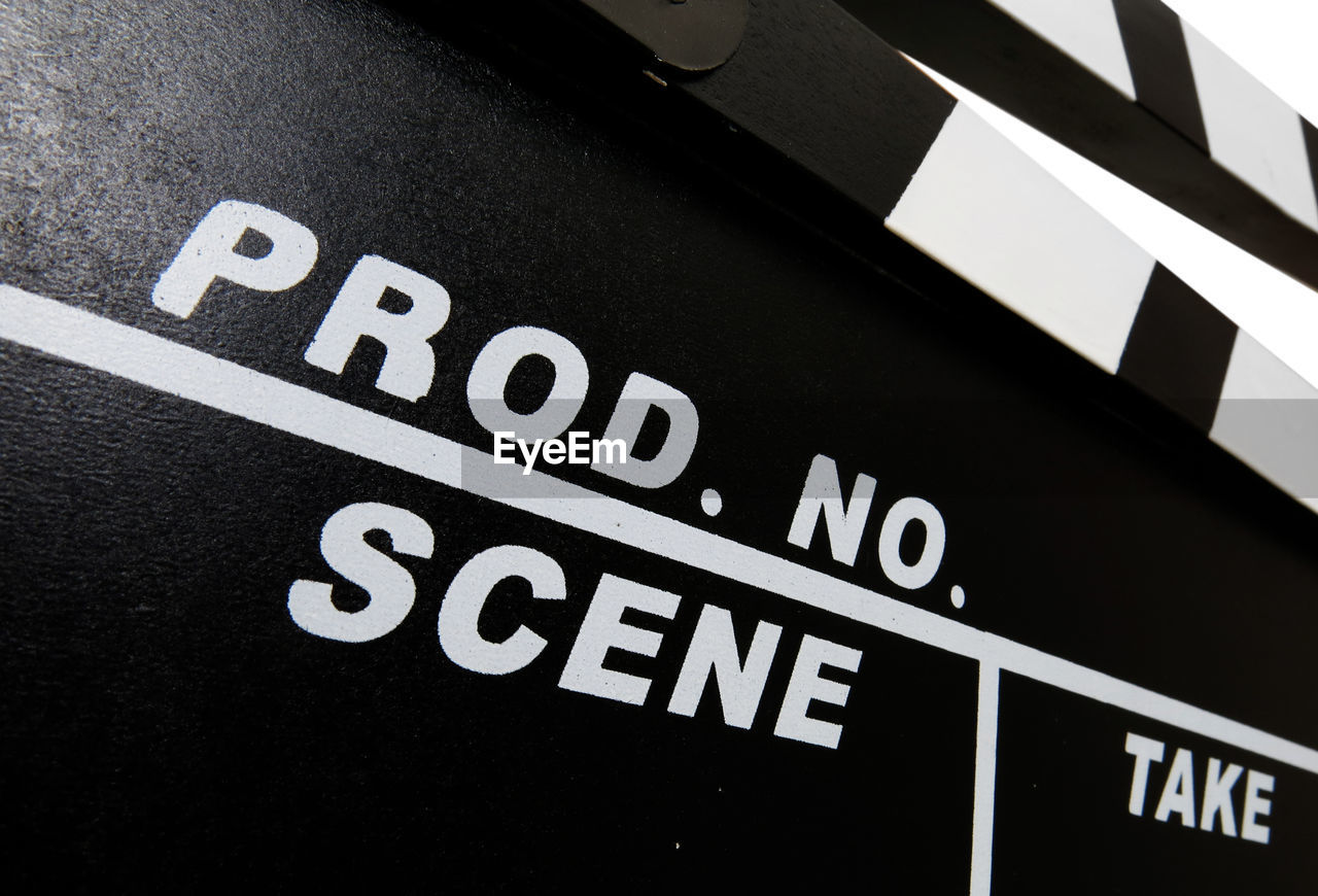 Close-up of text on clapperboard on white background