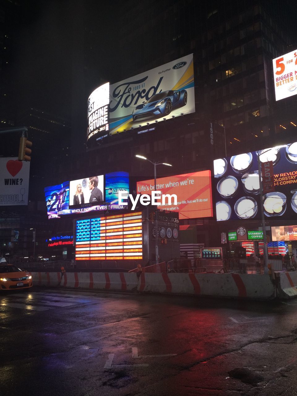 VIEW OF ILLUMINATED CITY AT NIGHT