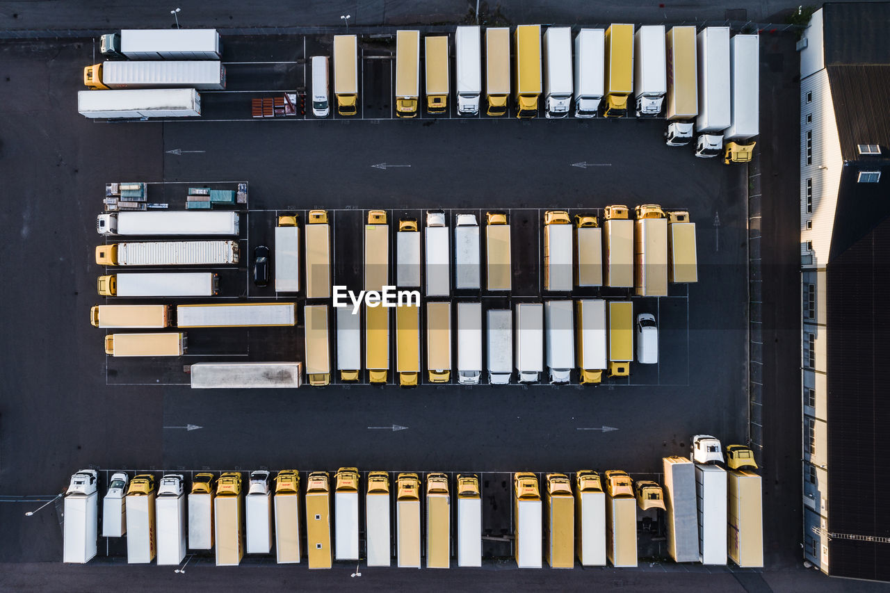 Aerial view of yellow and white trucks