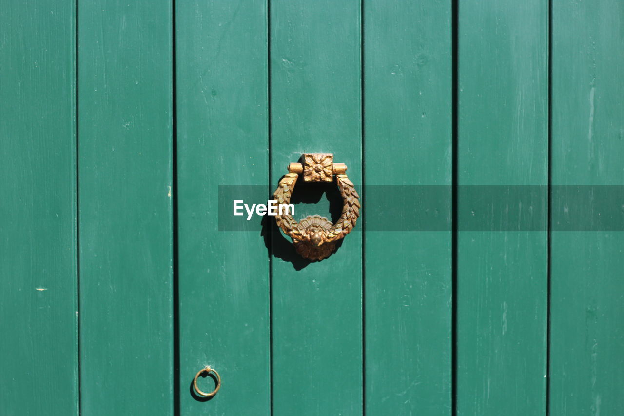 Close-up of green wooden door