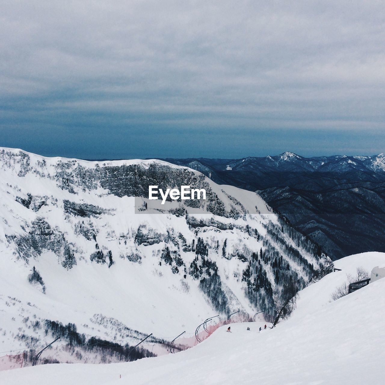 High angle view of ski resort against cloudy sky