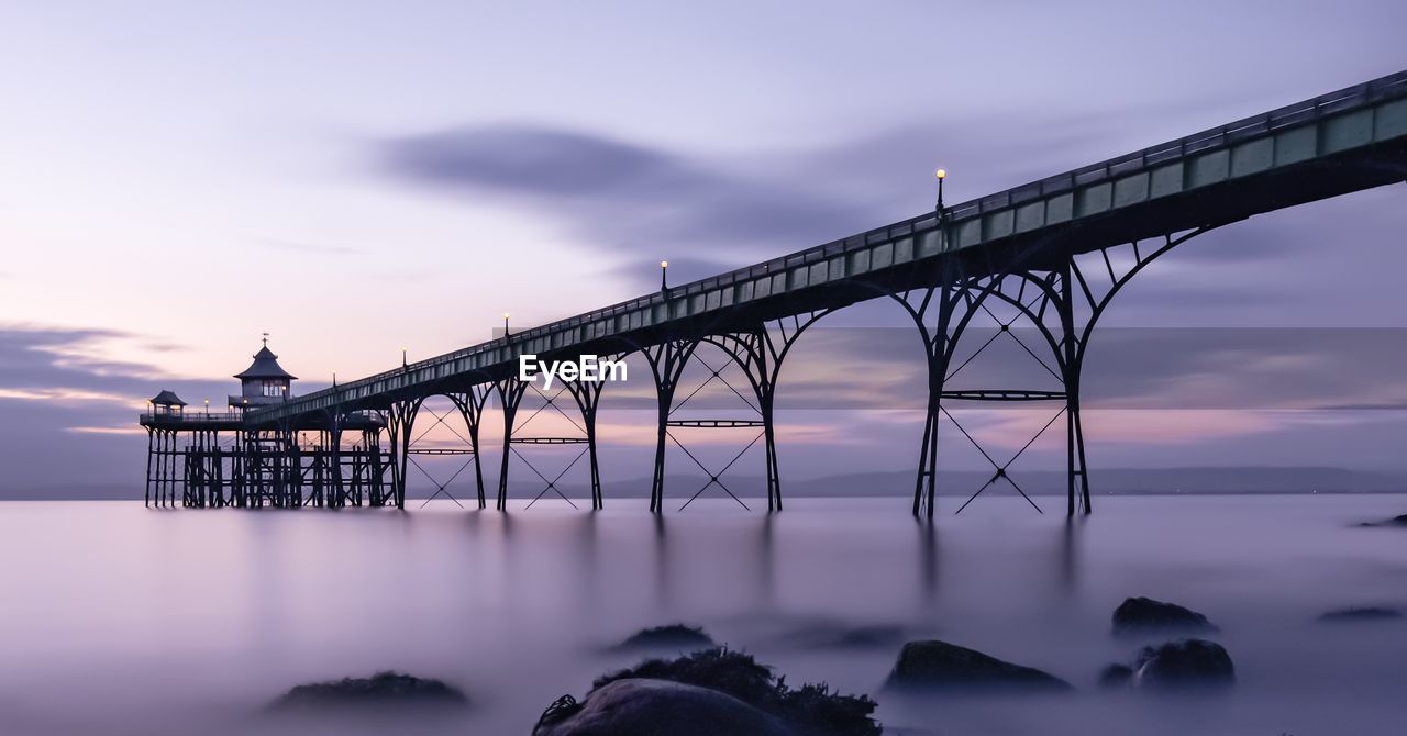 VIEW OF BRIDGE OVER RIVER AGAINST SKY