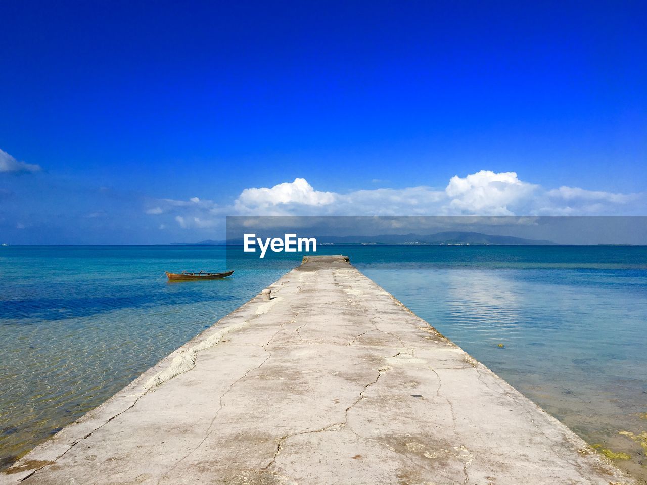 Scenic view of sea against blue sky