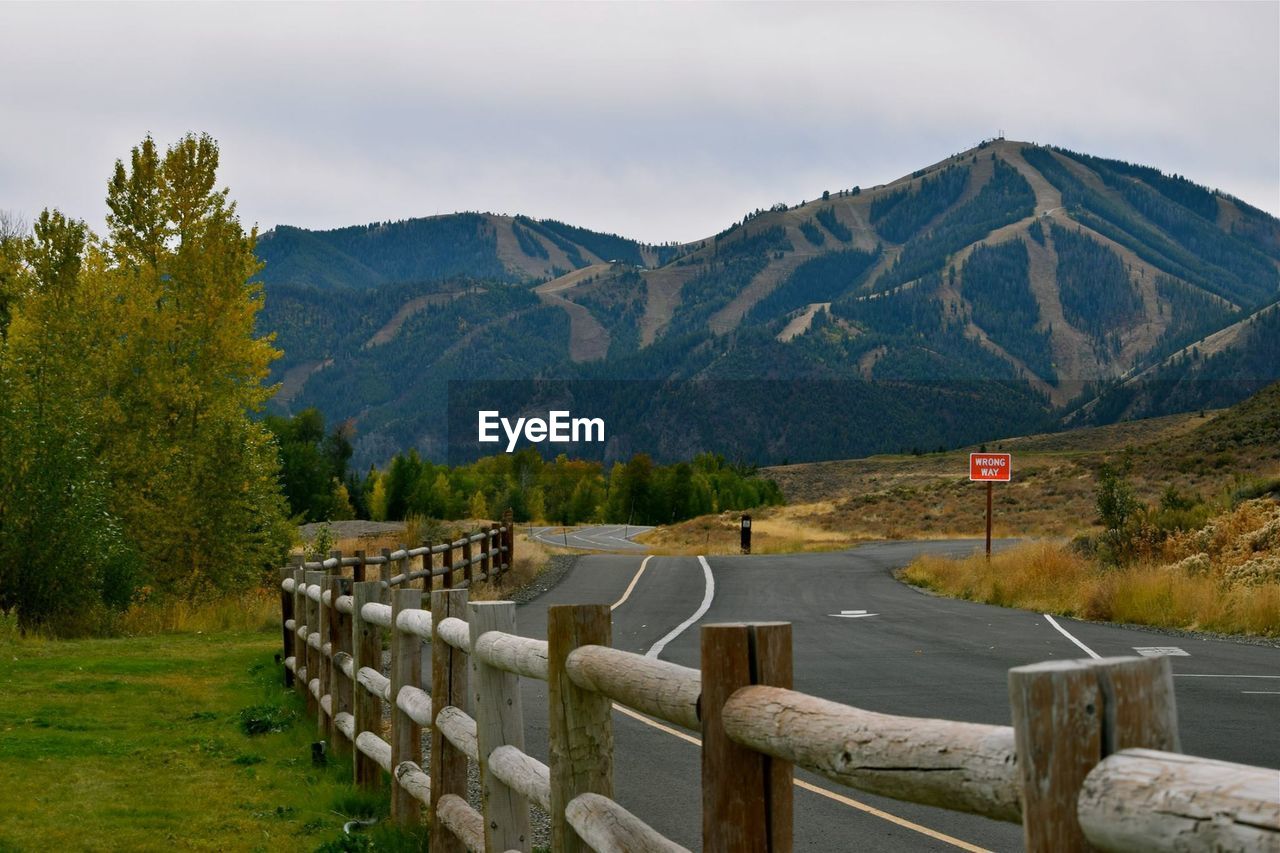 Wooden fence by road