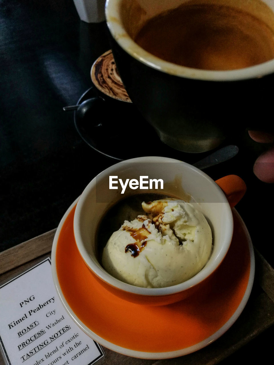 HIGH ANGLE VIEW OF CAPPUCCINO ON TABLE