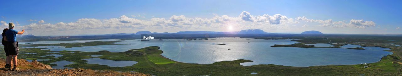 Panoramic view of sea and cityscape against sky