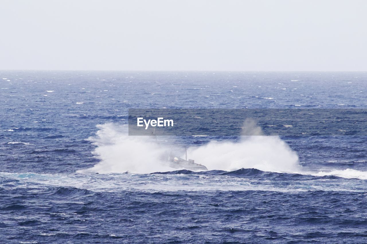 Boat in sea against sky