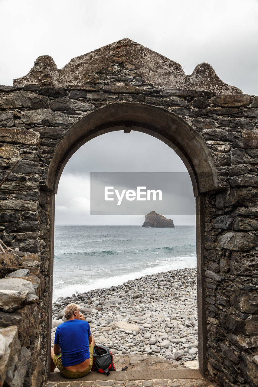 SCENIC VIEW OF SEA SEEN THROUGH ARCH