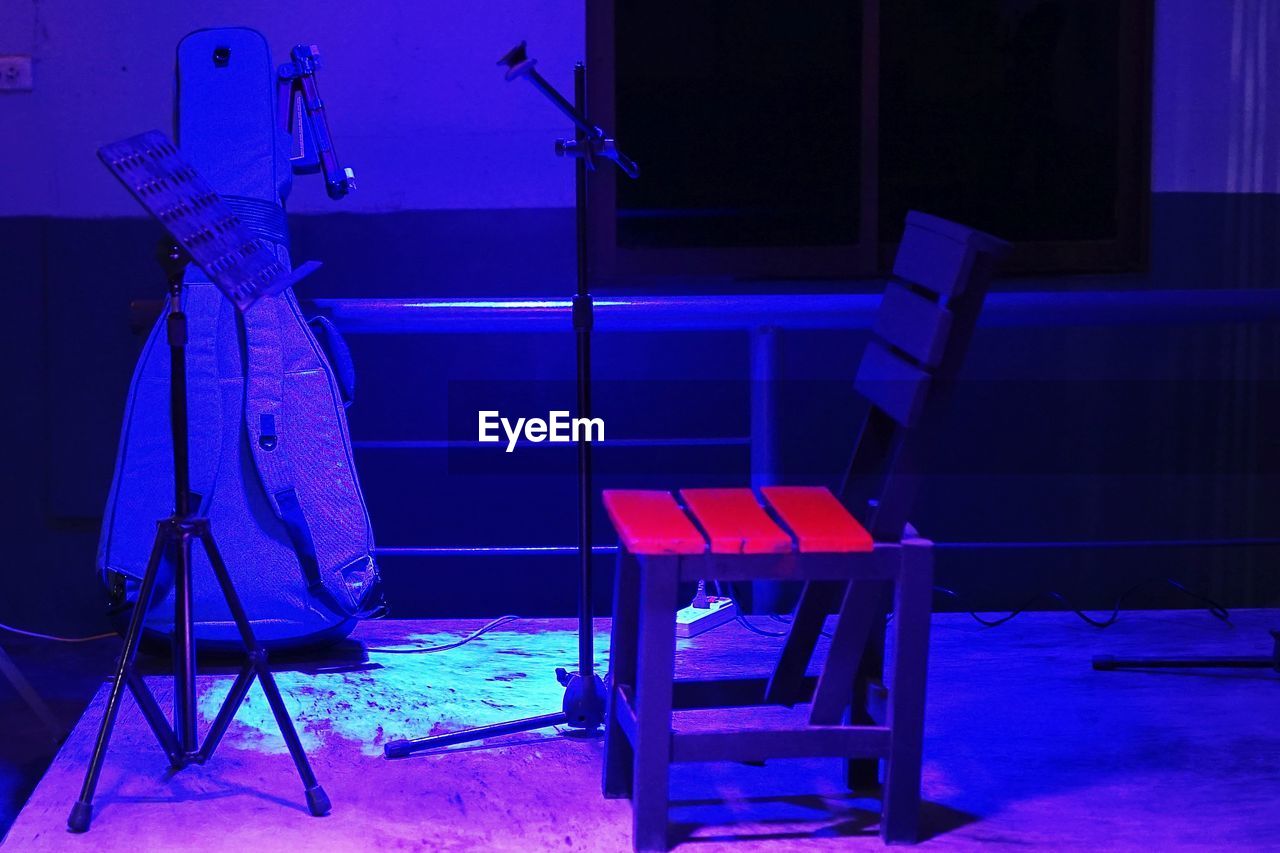 Empty chair with microphone stand