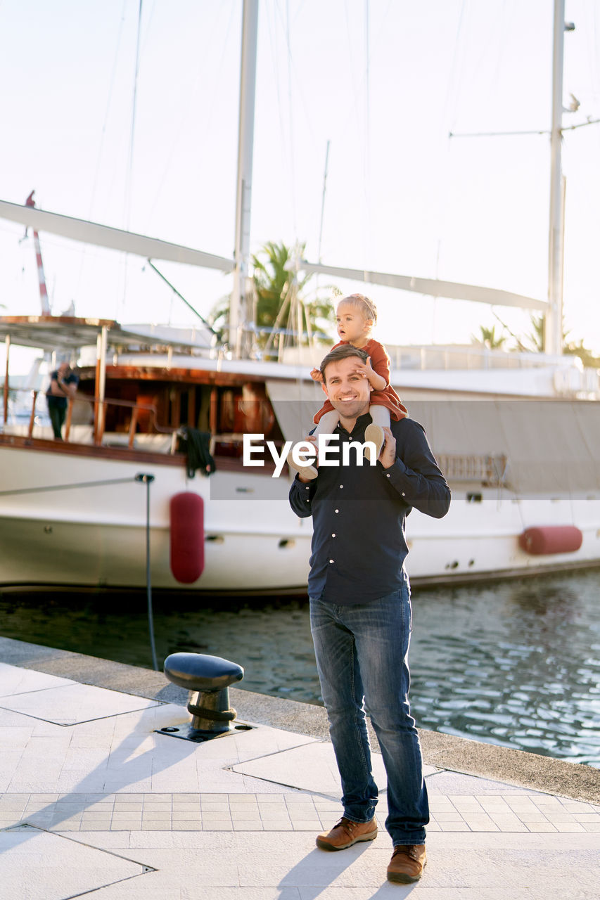 Full length of woman standing on boat