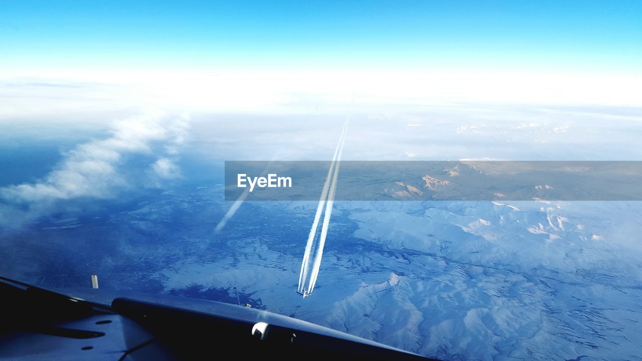 Aerial view of airshow seen through airplane window