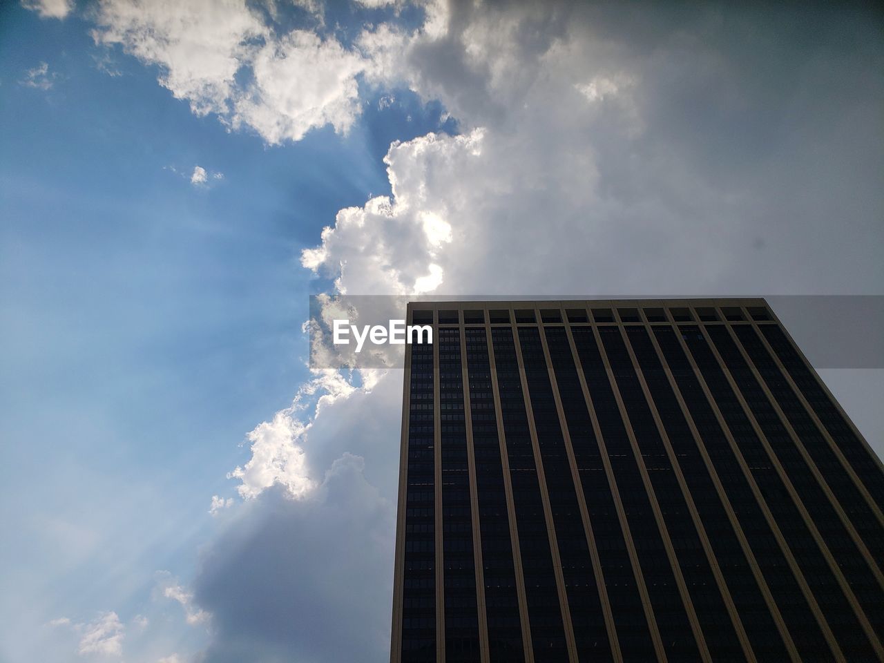 LOW ANGLE VIEW OF OFFICE BUILDING AGAINST SKY