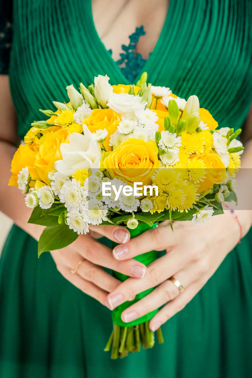 Close-up of woman holding bouquet