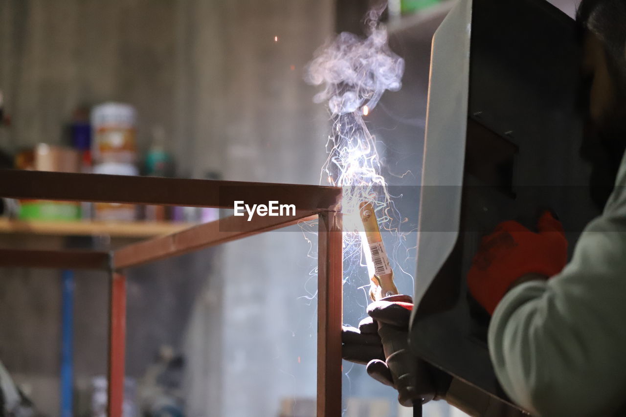 Low section of man working in factory