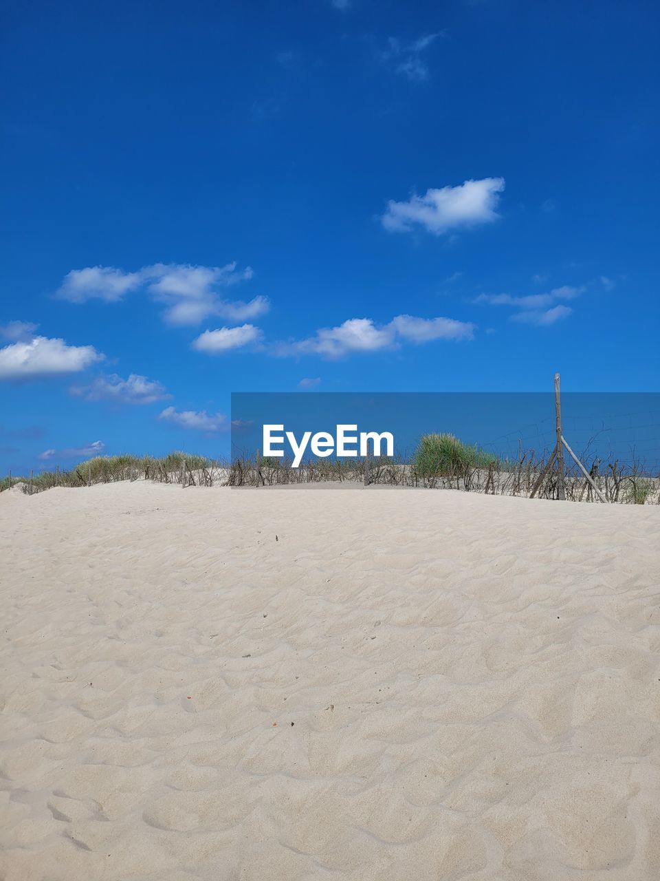 PANORAMIC VIEW OF BEACH AGAINST SKY