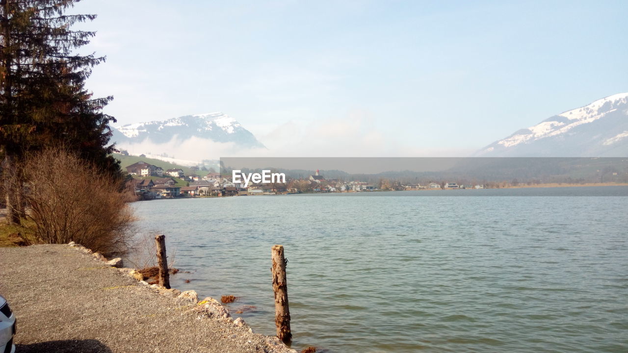 Scenic view of lake against blue sky