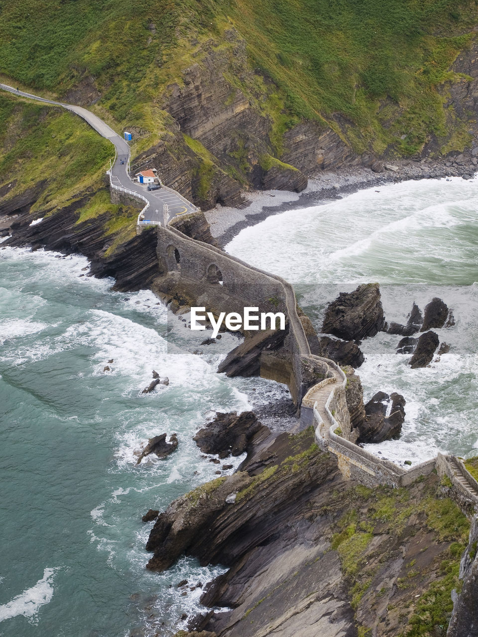 Aerial view of wall by sea