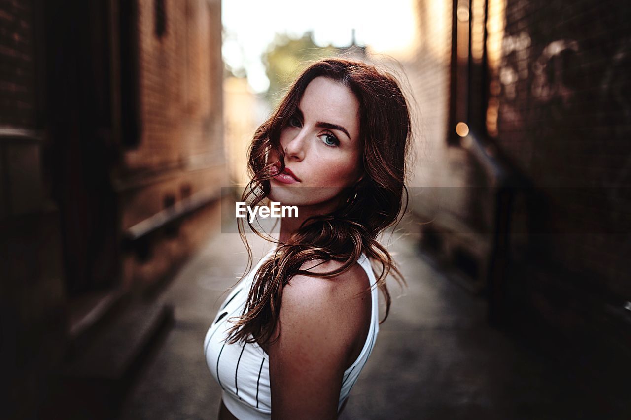 YOUNG WOMAN LOOKING DOWN