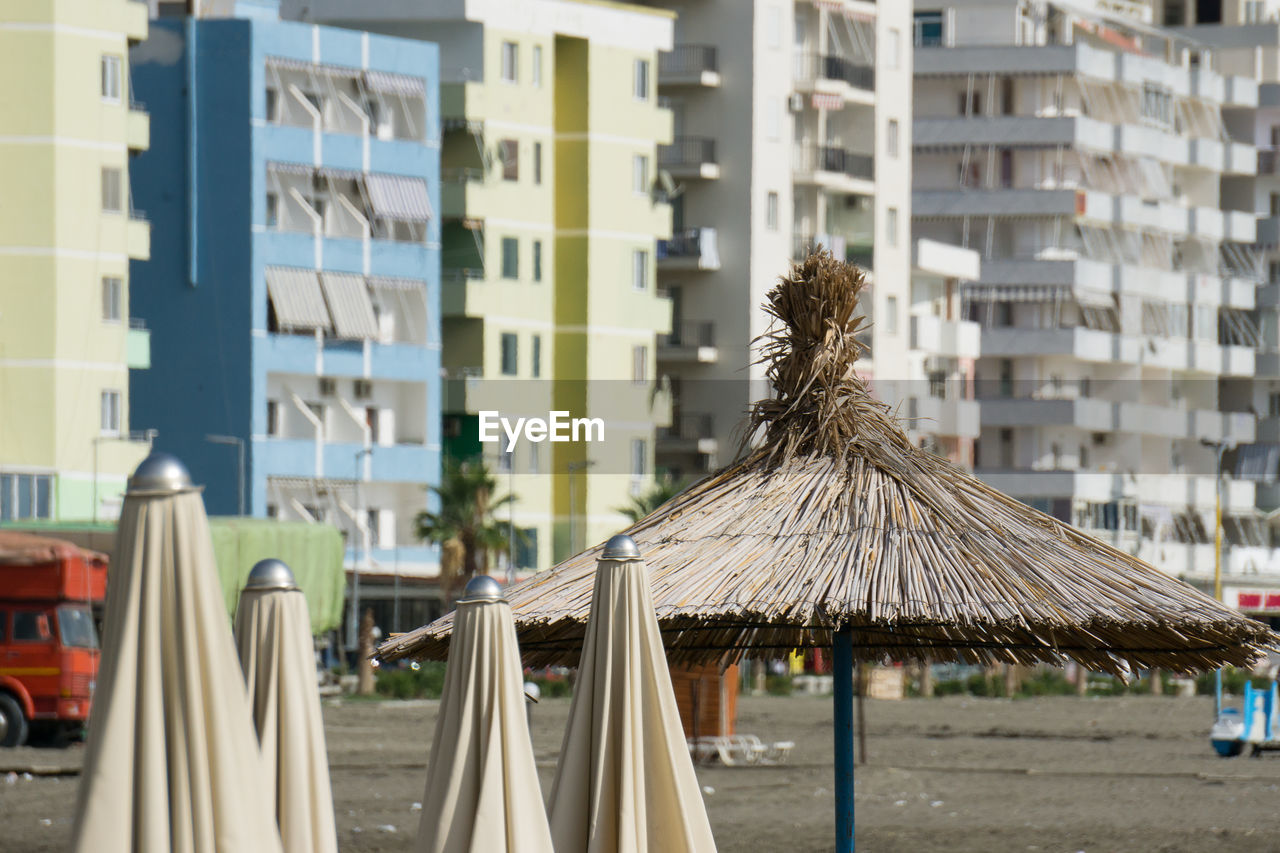  view of deserted beach against buildings in city