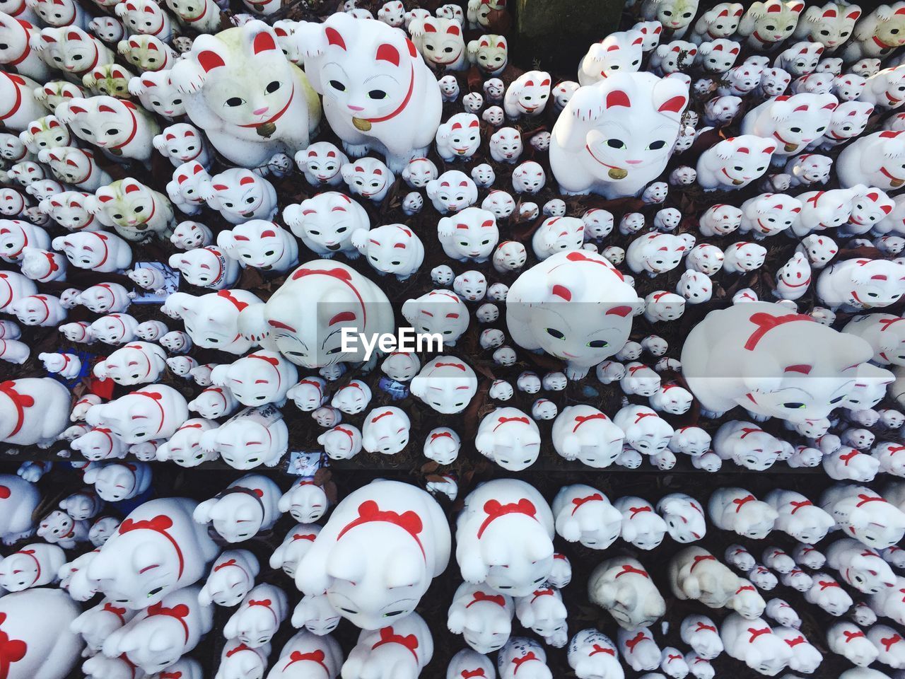 Full frame shot of white cat figurines for sale in market