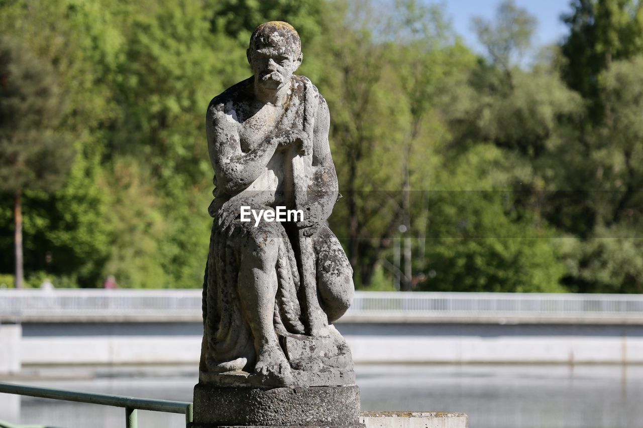 Statue against trees at hochablass augsburg