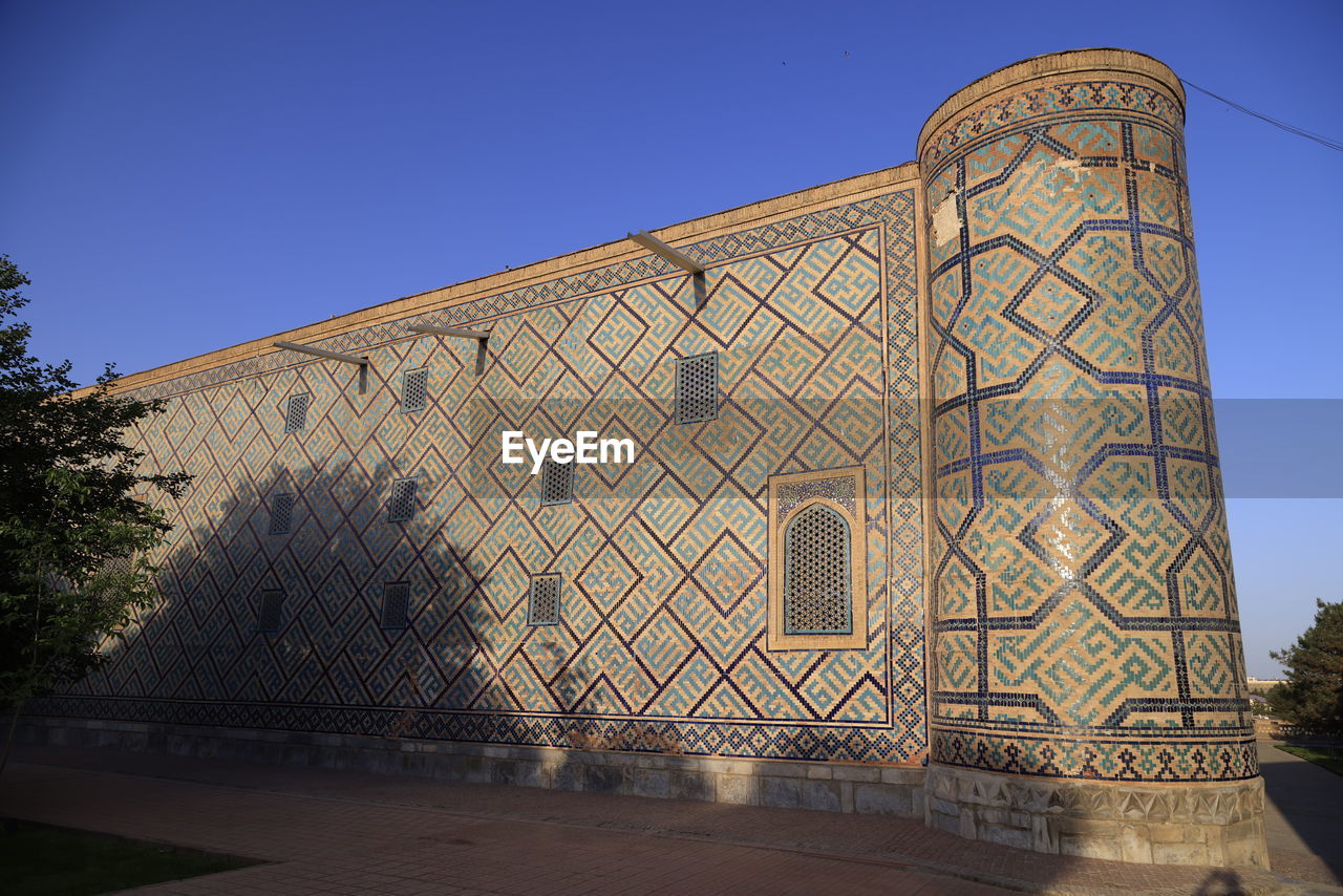 architecture, landmark, built structure, sky, building exterior, nature, travel destinations, blue, clear sky, no people, plant, tree, city, history, outdoors, building, travel, the past, religion, place of worship, sunny, day