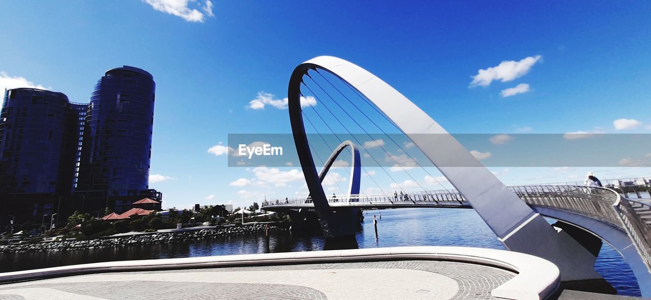 VIEW OF MODERN BRIDGE AGAINST BUILDINGS