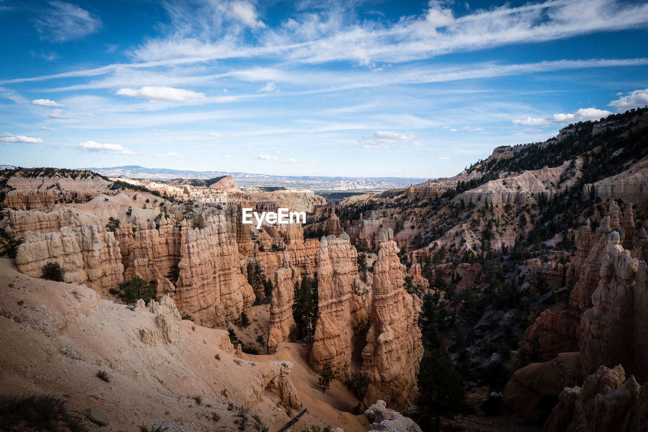 Scenic view of rocky mountains against sky