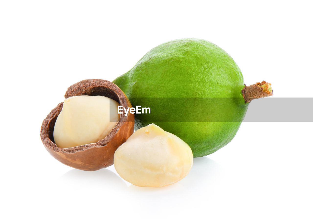 CLOSE-UP OF APPLES ON WHITE BACKGROUND