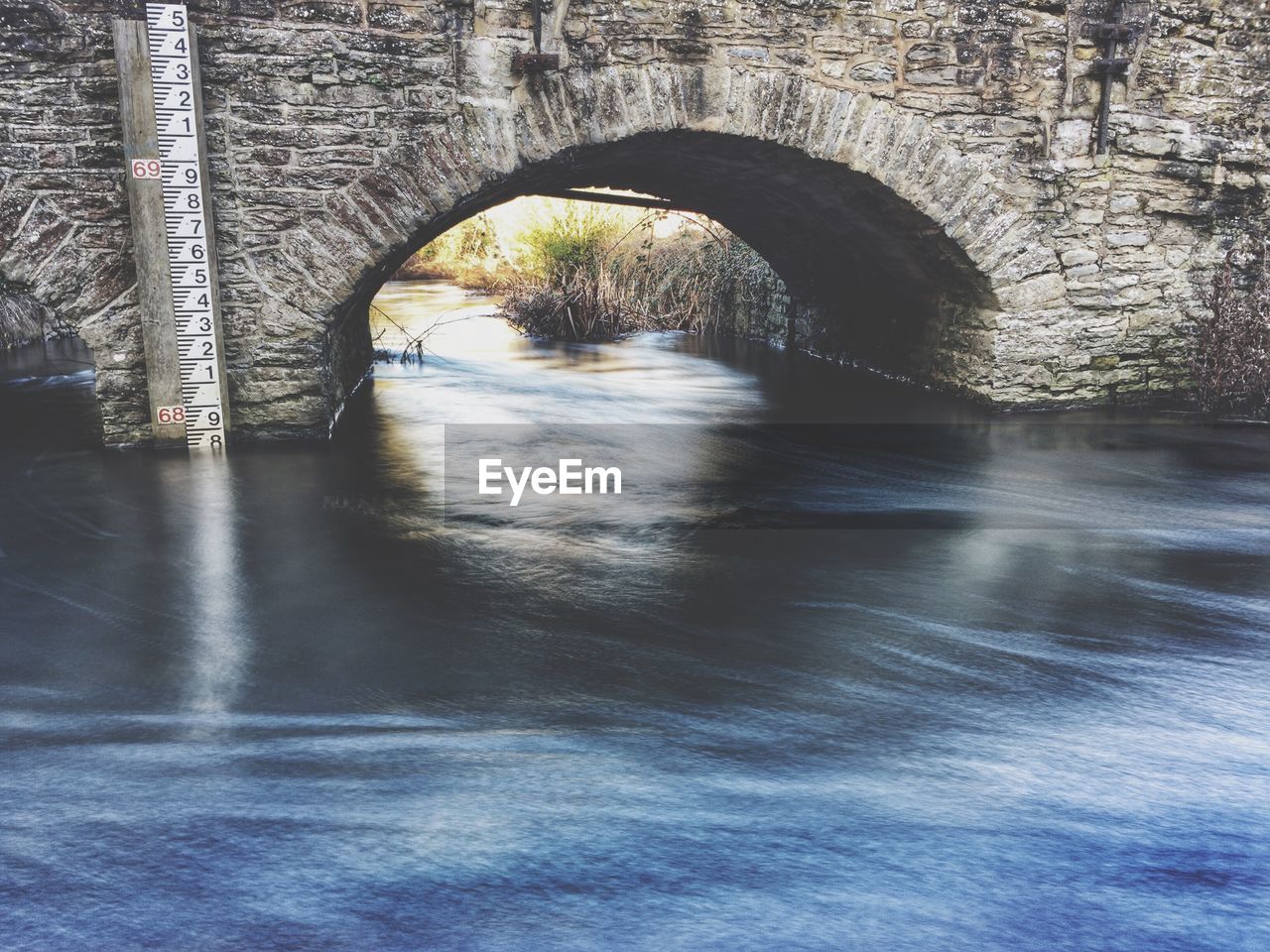 Arch bridge over river