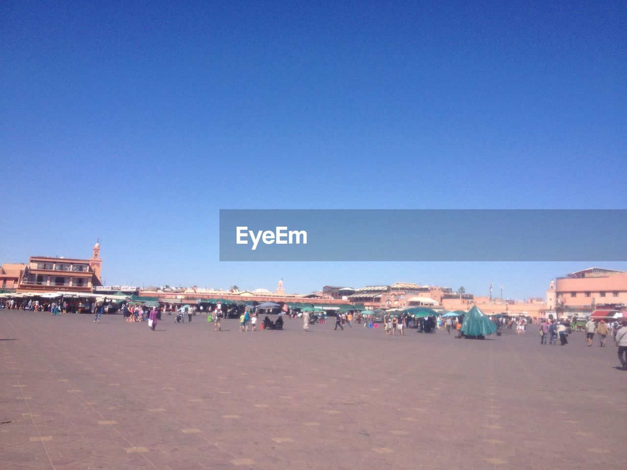 PEOPLE AT OBSERVATION POINT AGAINST CLEAR SKY