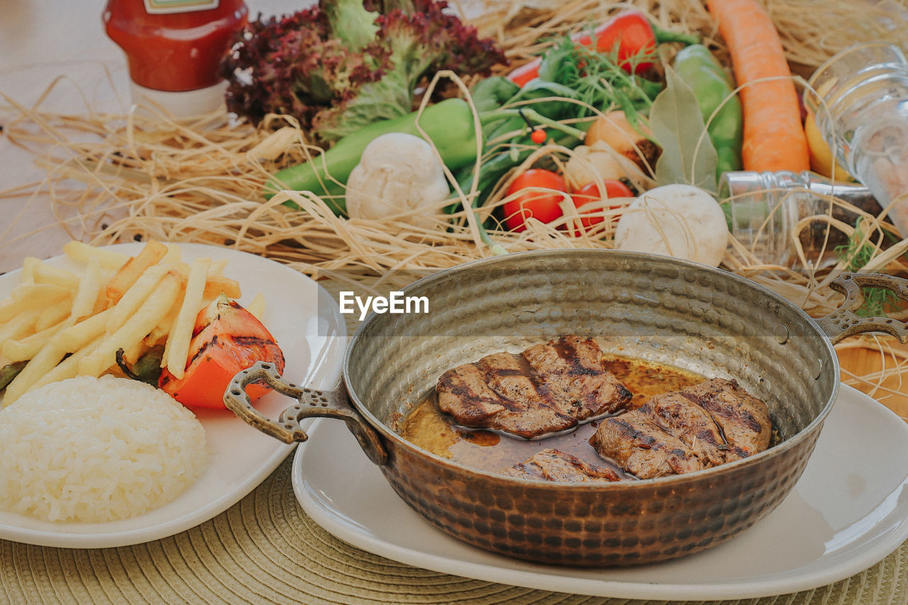 High angle view of vegetables in basket on table