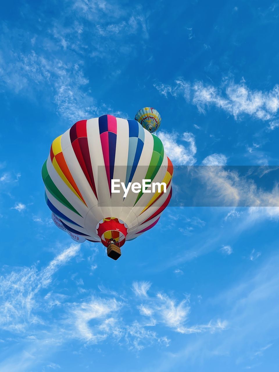 low angle view of hot air balloons flying against sky