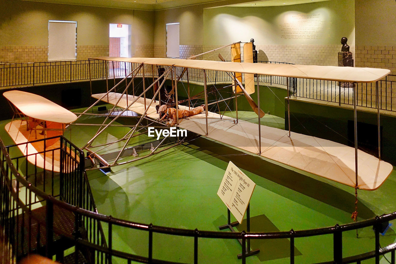 HIGH ANGLE VIEW OF BIRD IN CAGE