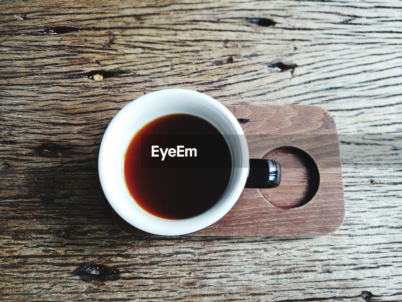 DIRECTLY ABOVE SHOT OF COFFEE CUP AND TEA ON TABLE