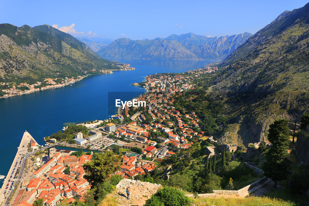 High angle view of kotor town by sea amidst mountains