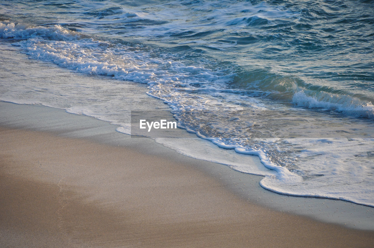 High angle view of surf on beach