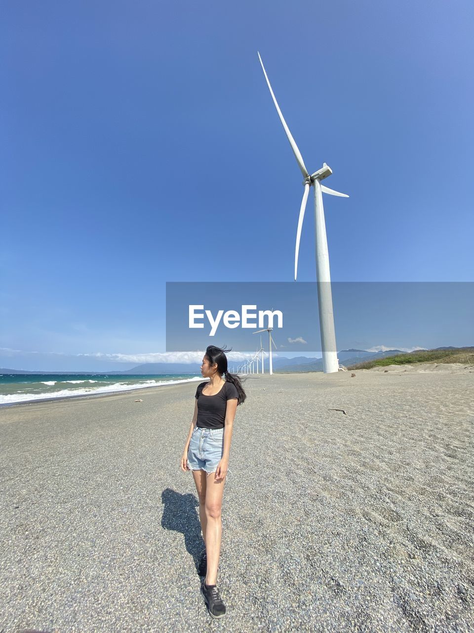 Low section of woman standing on pier