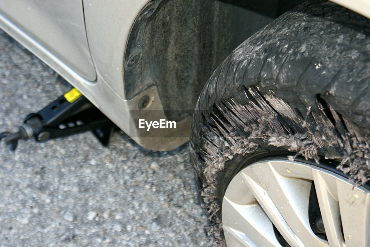 CLOSE-UP OF CAR ON TIRE