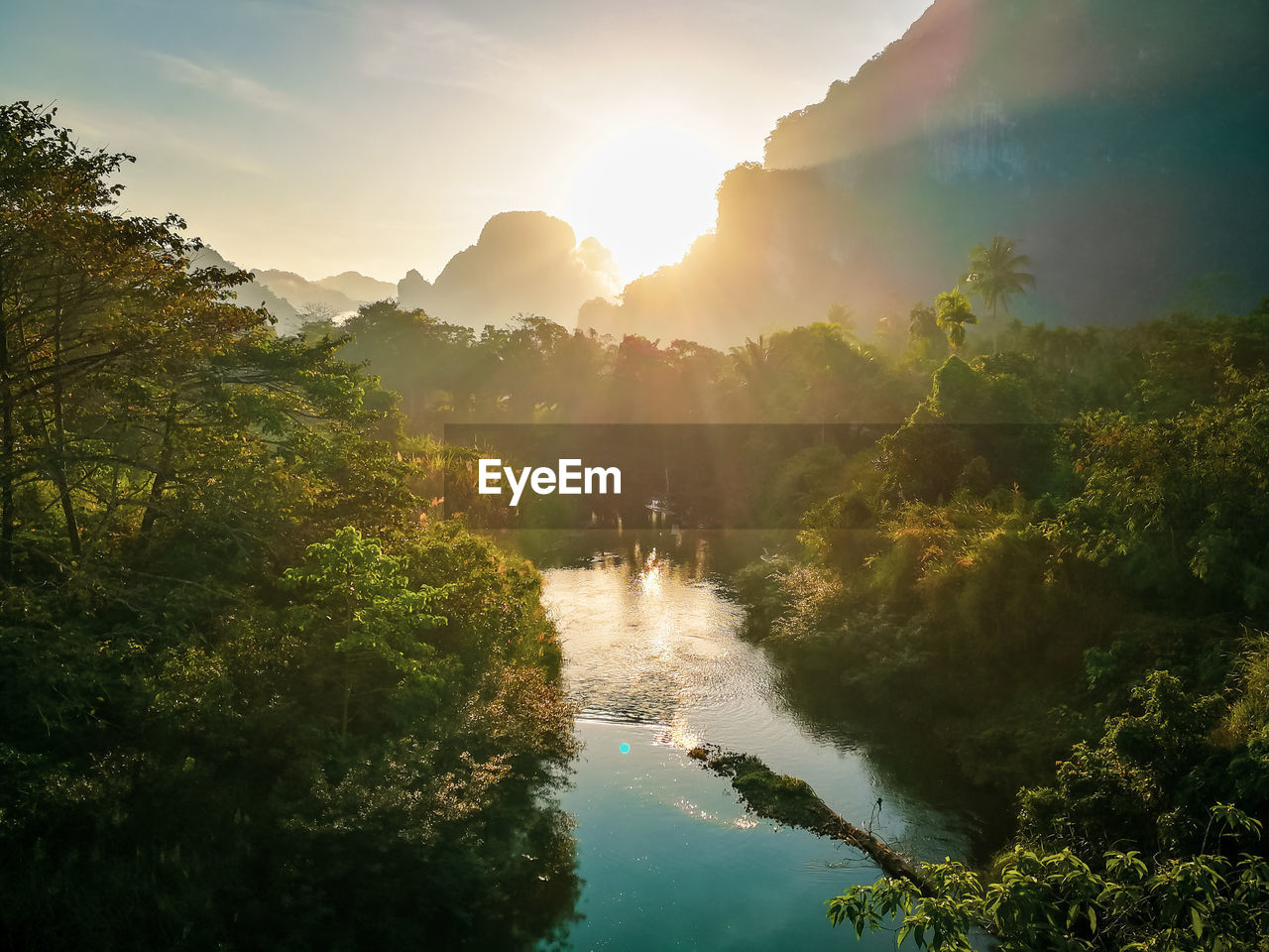 Scenic view of river against sky during sunset