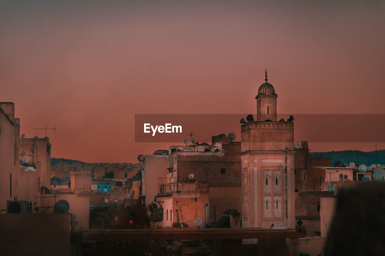 Buildings in fez old city against sky during sunset in morocco