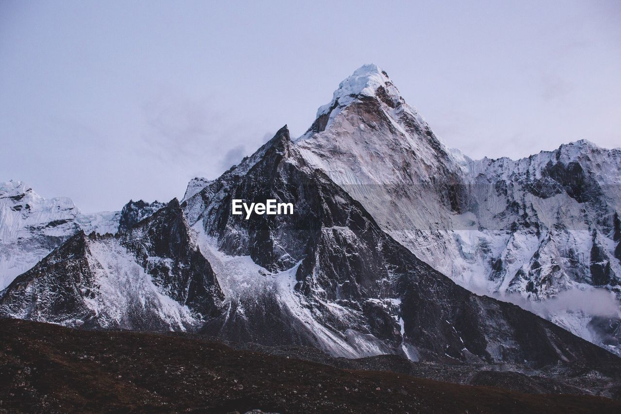 Scenic view of snowcapped ama dablam against sky