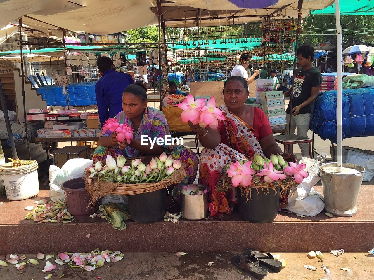 WOMAN SELLING FRUITS FOR SALE