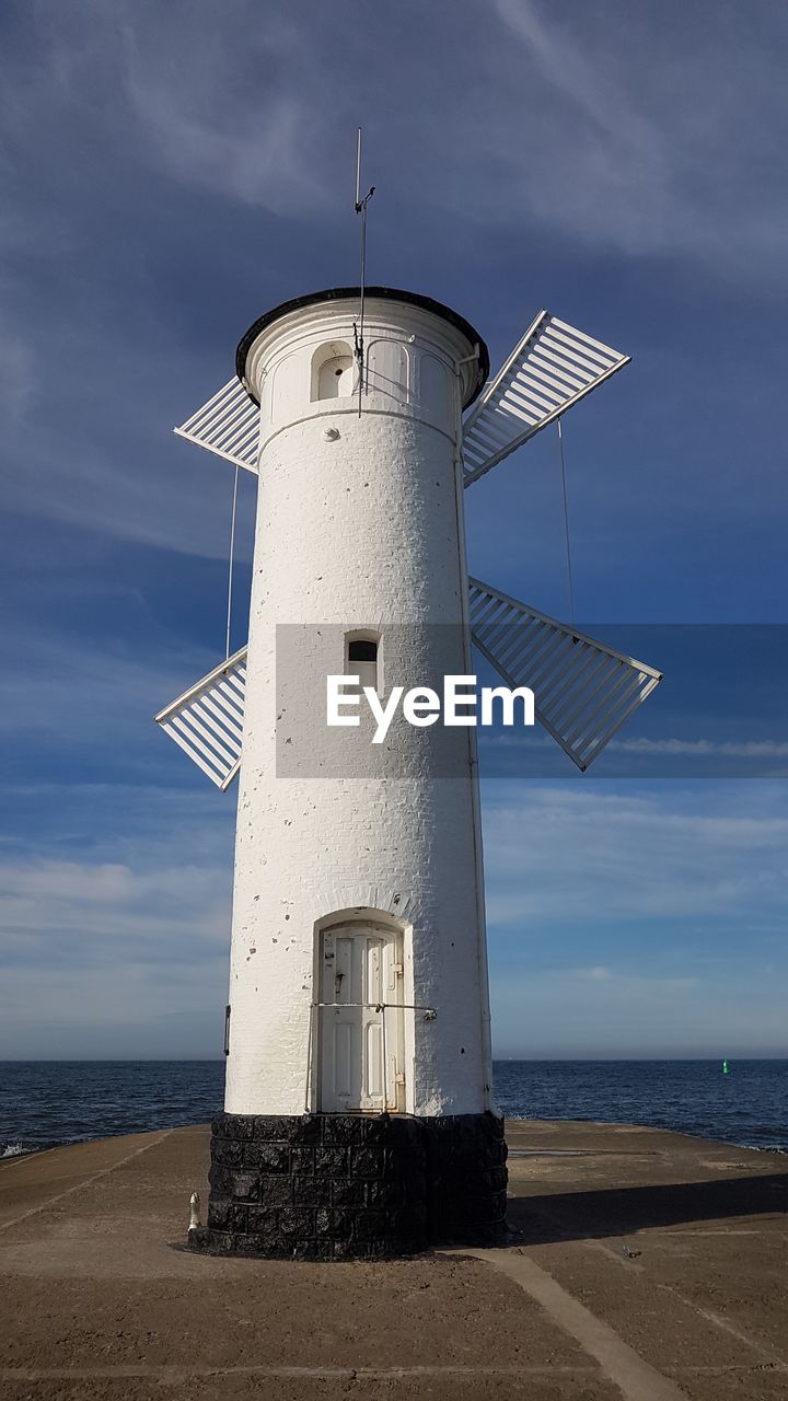 LIGHTHOUSE AGAINST SKY