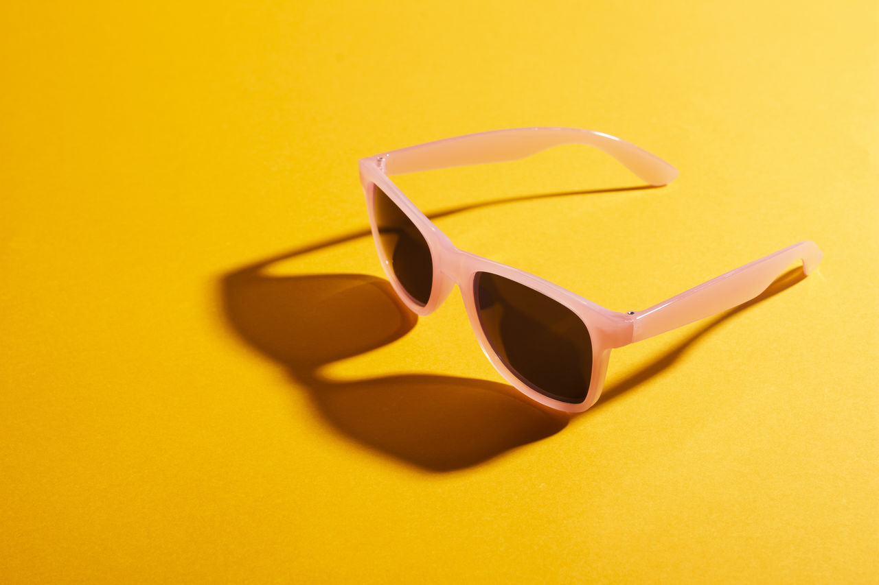 yellow, colored background, yellow background, fashion, sunglasses, studio shot, glasses, eyewear, single object, no people, goggles, indoors, shadow, close-up, vision care, still life, copy space