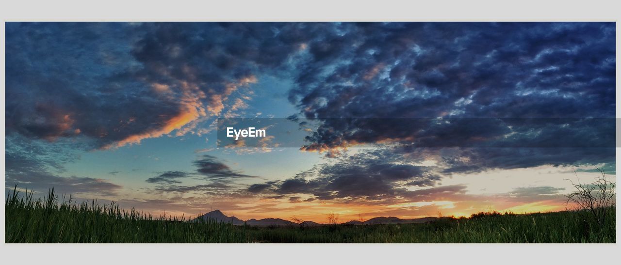 SCENIC VIEW OF DRAMATIC SKY OVER SILHOUETTE LANDSCAPE