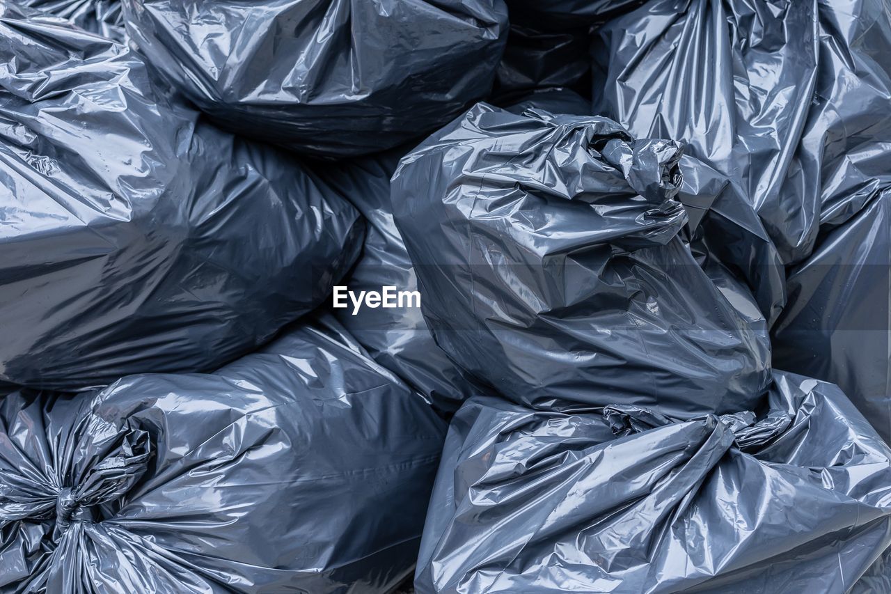 Full frame shot of stacked garbage bags