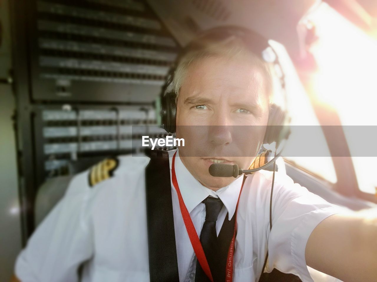 Portrait of pilot holding camera