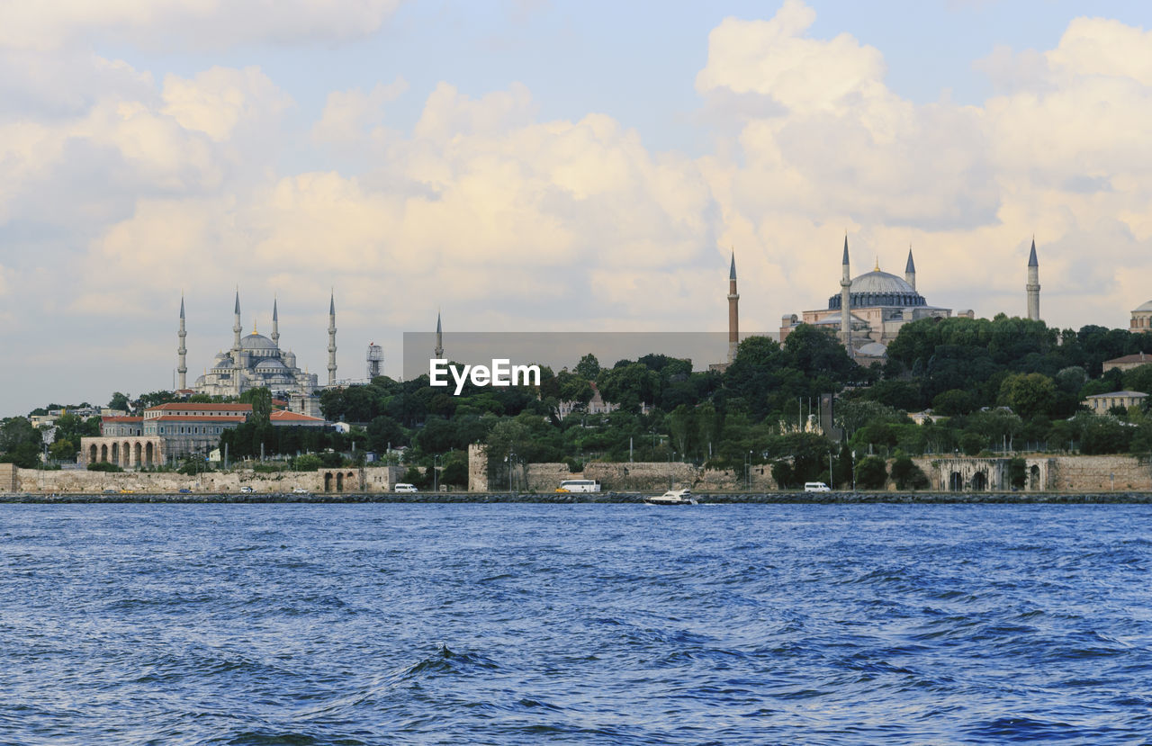 Hagia sophia and blue mosque against cloudy sky